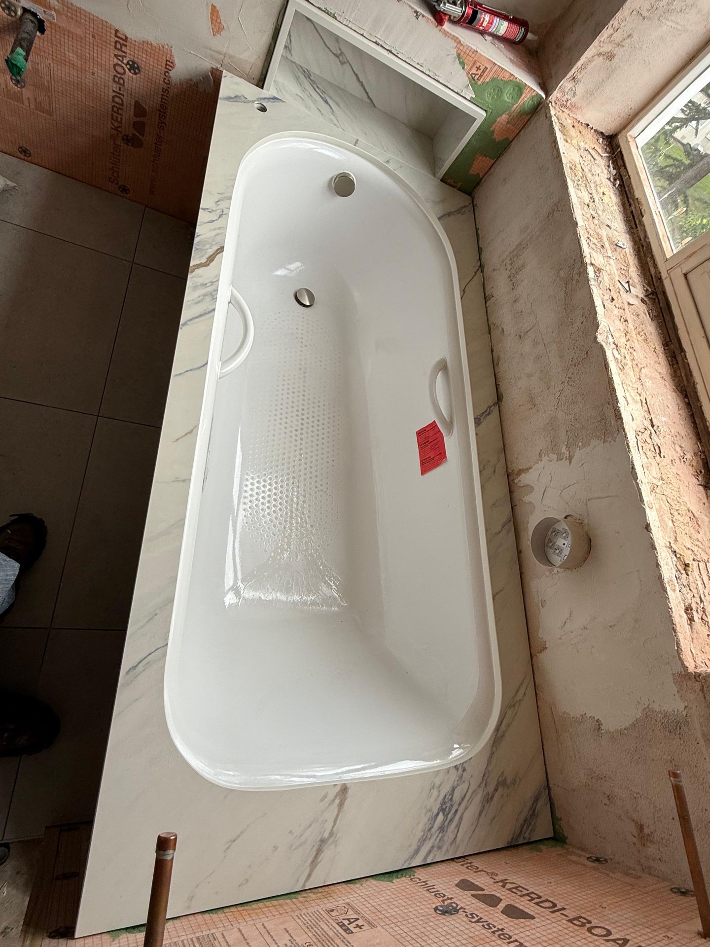 Marble bath surround with recessed shelf niche